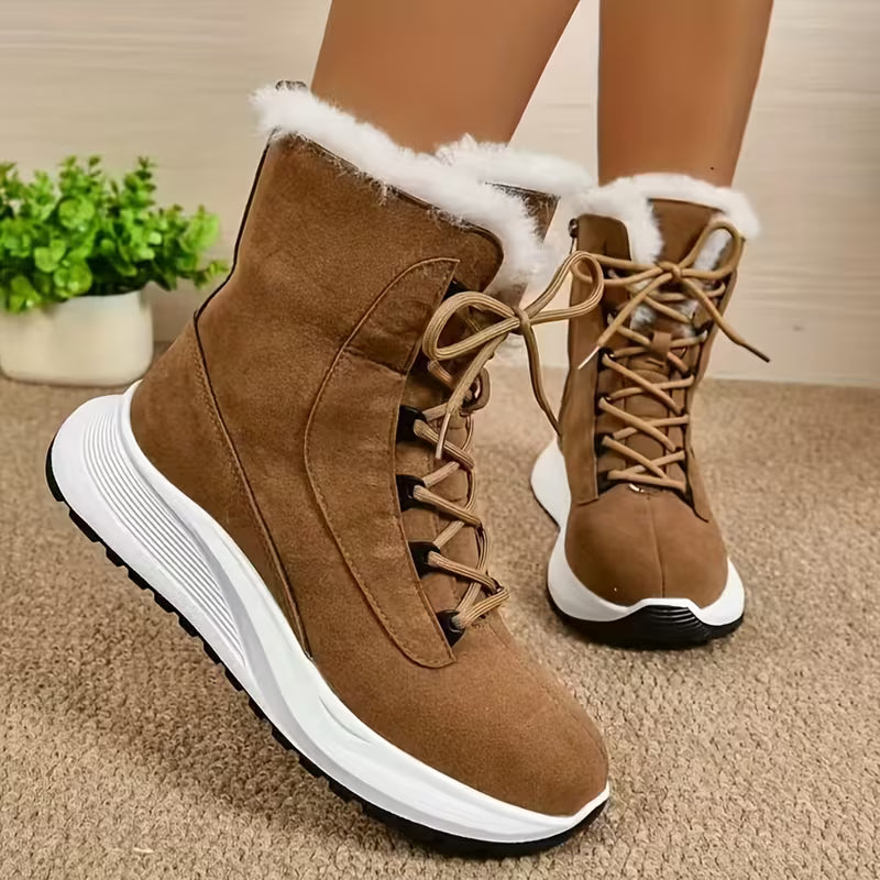Brown winter boots with white fur lining on a beige carpet